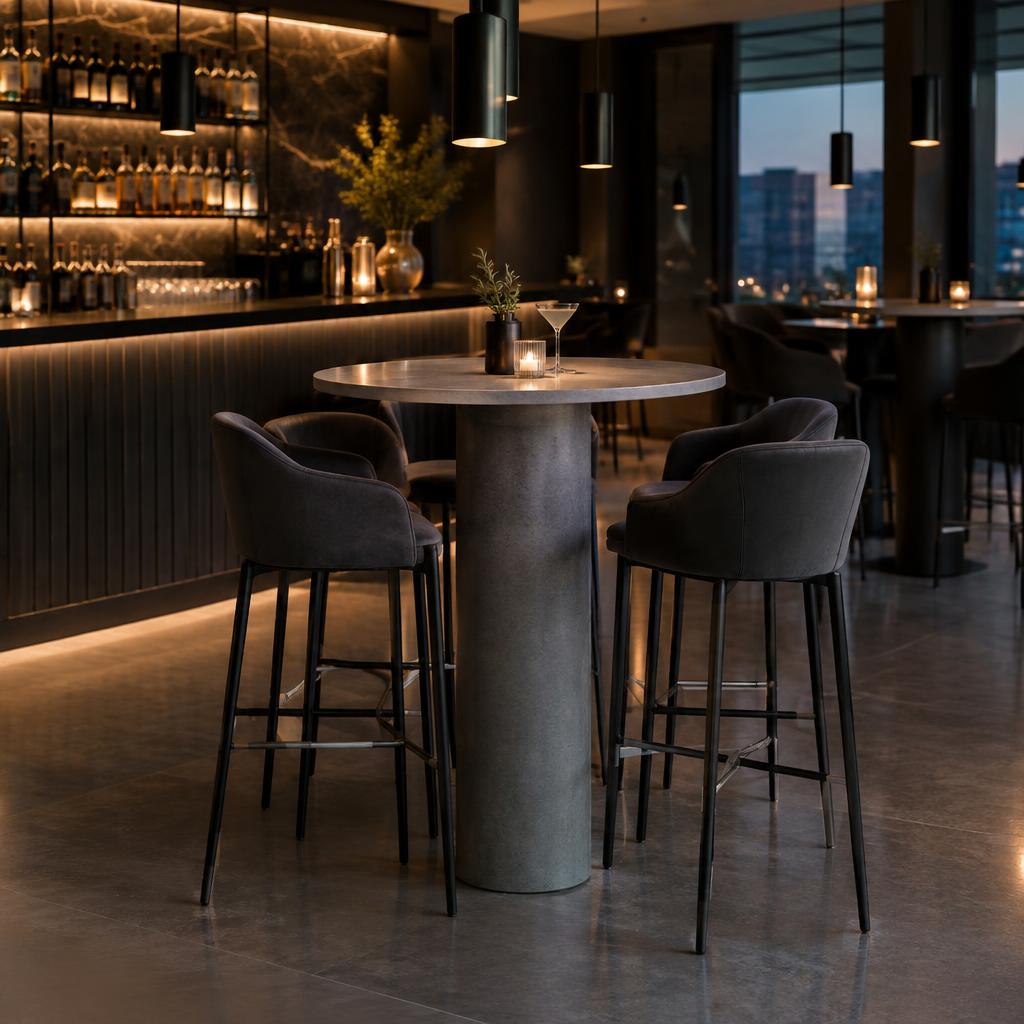 Tall round bar-height quartz posing table in a concrete grey look
